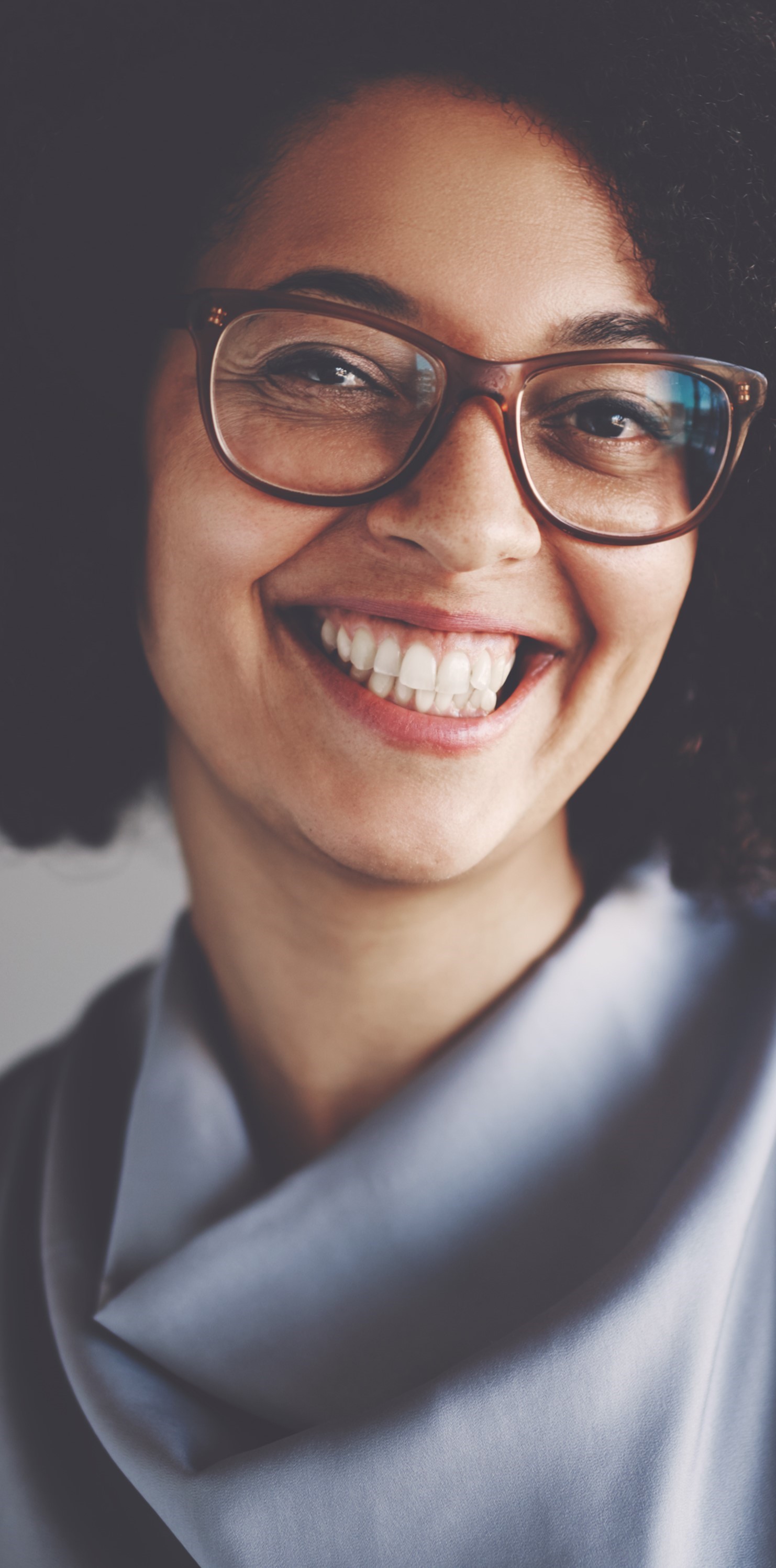 Smiling Woman with Glasses